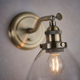 Lacona Hanley 1Lt Indoor Wall Light In Antique Brass Plate & Clear Glass Finish - Lacona Home 